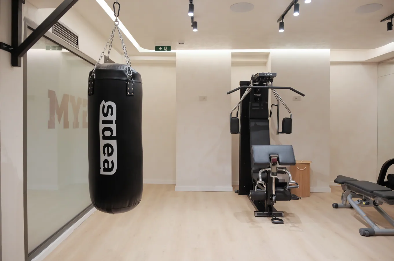 The heavy bag and resistance station in the gym