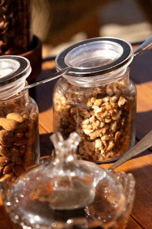 Jars of nuts and granola on the breakfast counter
