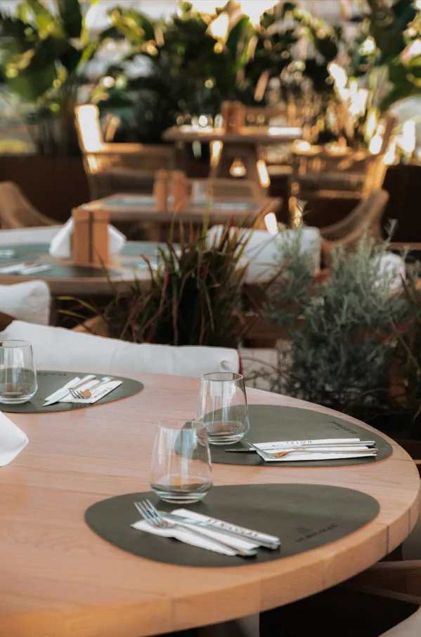 Tables set among the planting on the roof terrace