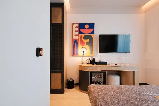 The desk and mini bar in a Double Room with City View