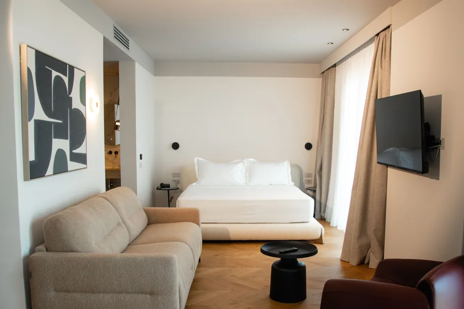 The bed and sofa in Suite 305